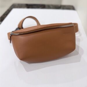 Faux leather woman’s cross body brown sling bag